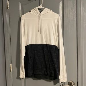 Long sleeve shirt with hood and drawstrings.